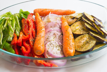 vegetable tray for baking Onion, pepper red and green, carrot and eggplant