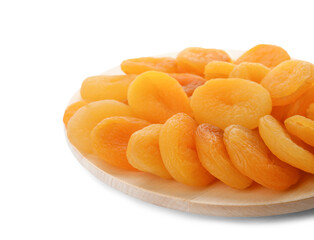 Wooden tray with tasty dried apricots isolated on white