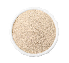 Granulated yeast in bowl isolated on white, top view