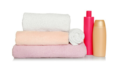 Obraz na płótnie Canvas Soft terry towels and cosmetic products on white background