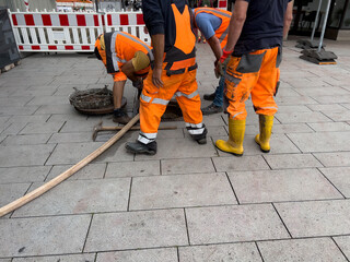 Worker at sewer cleaning work