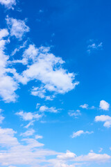 Fototapeta premium Blue sky and clouds - vertical background