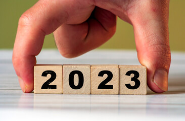 2023 change year concept. Cube block with 2023 inscription as start New Year 2023. start new business target strategy concept. Loading year
