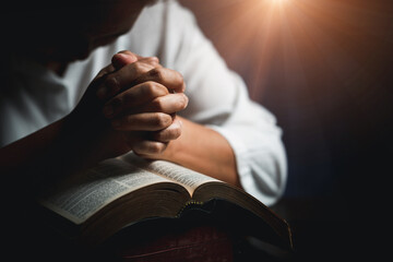 Worship christian with bible concept. Young woman person hand holding holy bible with study at...