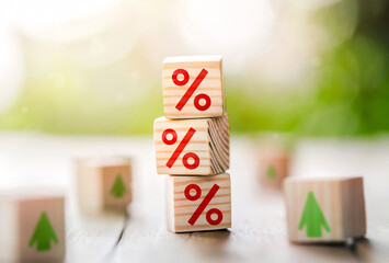 Interest rate financial and mortgage rates concept. Wooden cube block with interest rate and up...