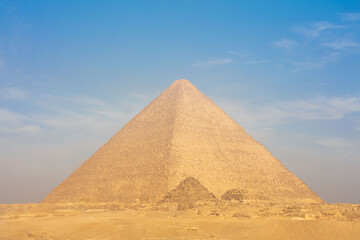 Fototapeta na wymiar Egyptian pyramids in sand desert and clear sky.
