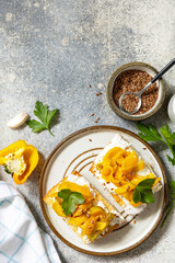 Open sandwiches set with grill bulgarian pepper and cream cheese philadelphia on a stone table. Healthy food, vegetarian appetizer. View from above. Copy space.