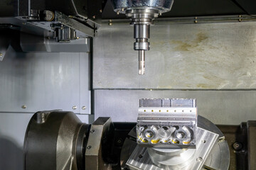 The 5-axis machining center cutting the V8 cylinder block with solid ball end mill tool.