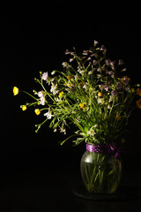 A bouquet of wild flowers in low key