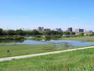 台風で冠水したグラウンドのある秋の江戸川河川敷風景