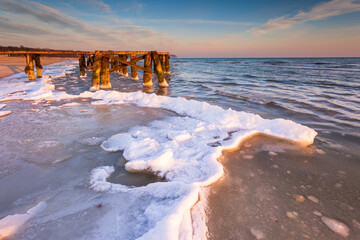 Early morning at frozen small pier in Sopot. Poland.