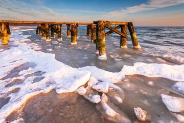 Early morning at frozen small pier in Sopot. Poland.