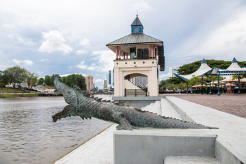 Kuching Malaysia Sep 3rd 2022:Bronze stylized crocodile sculpture At The Riverbank Of Sarawak River...