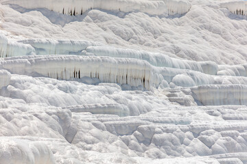 White volcanic limestone rock as background.