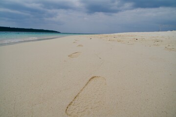 Footprints on the sand of Yonaha Beach