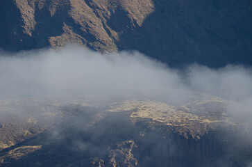 Slope, plateau and cliffs covered by clouds. The Nublo Rural Park. Gran Canaria. Canary Islands. Spain.