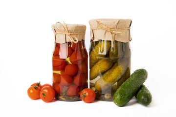 Jars with pickled vegetables. Pickled food.Jars of pickled vegetables: cucumbers and tomatoes...