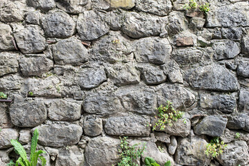 Gabion retaining wall made of concrete and stone in a mountainous terrain