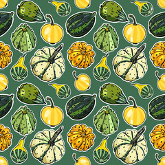 Seamless vector texture of pumpkins on green background (halloween wrapping paper)