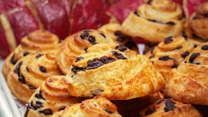 Freshly baked poppy seed buns are sold at a street stall. Close-up