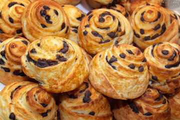 Freshly baked poppy seed buns are sold at a street stall. Close-up