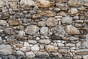 Gabion retaining wall made of concrete and stone in a mountainous terrain