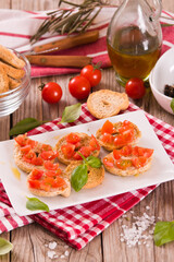 Friselle with cherry tomatoes and basil.
