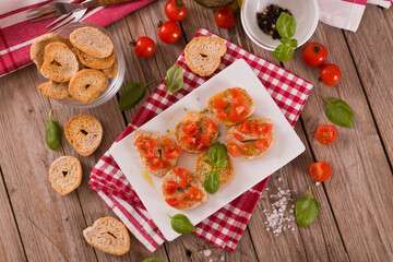 Fototapeta na wymiar Friselle with cherry tomatoes and basil.