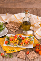 Rye bread withsweet corn, basil and tomato.