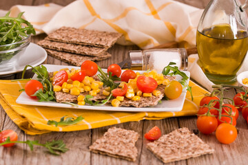 Rye bread withsweet corn, basil and tomato.