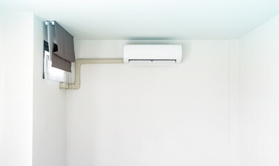 Fototapeta na wymiar Air conditioner on white wall