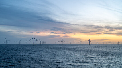 Different aspects of wonderful sunset offshore wind farm. - obrazy, fototapety, plakaty