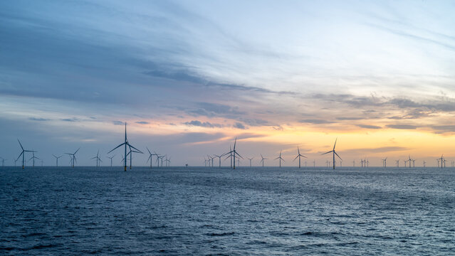 Different aspects of wonderful sunset offshore wind farm.
