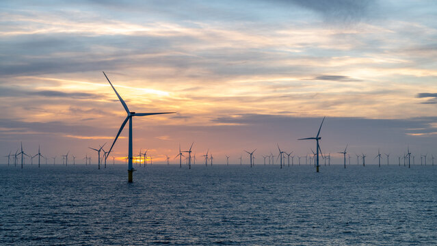 Different aspects of wonderful sunset offshore wind farm.