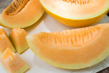 sliced of melons, fresh Melon or cantaloupe, Cantaloupe melons on wood background, Favorite fruit in summer