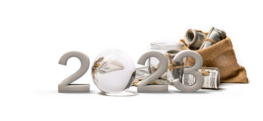 The text 2023 made from metallic and crystal ball with much of money on background.