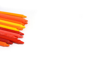 Crayons lined up isolated on white background.
