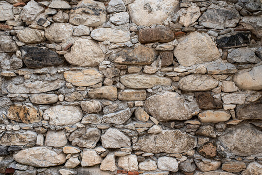 Gabion retaining wall made of concrete and stone in a mountainous terrain