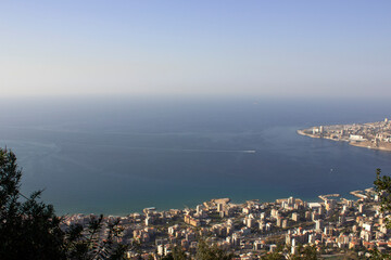 Fototapeta premium Aerial Panoramic view from top of Harissa Mountain of Jounieh bay, Jbeil Governorate of Lebanon