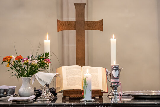 Festive interior decoration with burning candles in temple Church Christianity The ceremony of infant baptism Baptismal