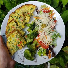 Low carbohydrate meal with omelette,  boiled brocoli and fresh salad for healthy life. Paleo food. Simple lowcarb meal.