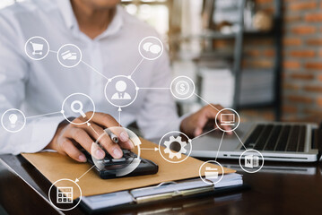 Businessman use the calculator and laptop with calculations about the expenses at the office.