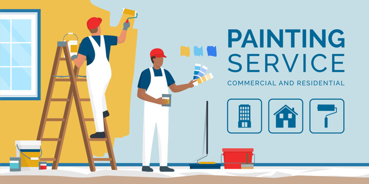 Professional painters and decorators painting a wall