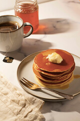 Drop scones in the morning light. White background, hard lights and pop colors