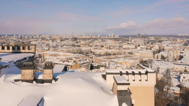European winter city scape with roofs covered with snow. Urbanscape after heavy snowfall.