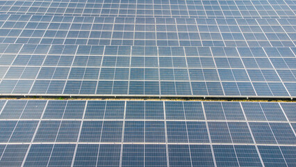 Solar cells on the solar farms of a large industrial factory. Solar farms are generating renewable energy for the industry. The goal is to reduce the cost of electricity.