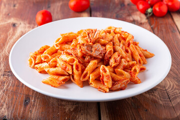 Pasta with tuna in tomato sauce, typical food of Mediterranean Italian cuisine.