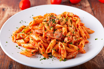 Pasta with tuna in tomato sauce, typical food of Mediterranean Italian cuisine.