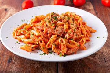 Pasta with tuna in tomato sauce, typical food of Mediterranean Italian cuisine.