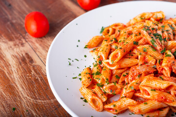 Pasta with tuna in tomato sauce, typical food of Mediterranean Italian cuisine.